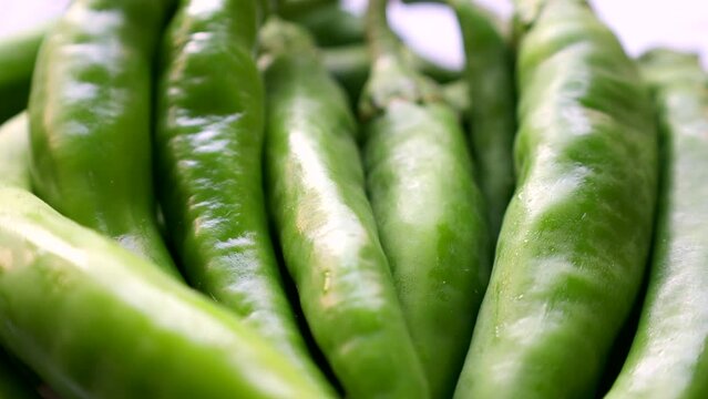 Fresh raw green chili pepper circle rotation close up