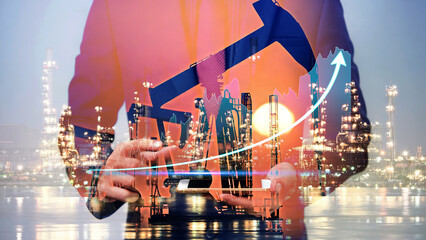 Businessman using digital tablet. Business global internet connection application technology digital marketing, Crude Oil pump oil rig energy industrial machine background. Crude oil increase price