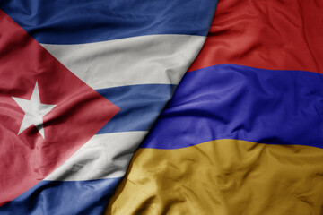 big waving national colorful flag of armenia and national flag of cuba .