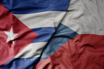 big waving national colorful flag of czech republic and national flag of cuba .