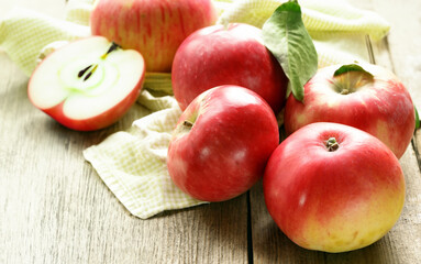 organic red apples on wooden table