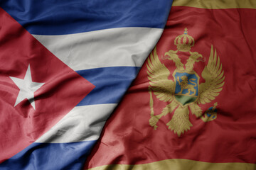 big waving national colorful flag of montenegro and national flag of cuba .