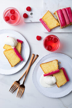 Fresh loaf cake decorated with roasted rhubarb. Sweet and delicious rhubarb dessert with ice cream