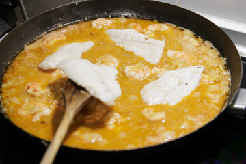 Fish in sauce with shrimp. Step by step preparation. Adding the ingredients