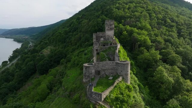 Aerial view of Hinterhaus Castle Ruins on green mountain in, Spitz, Austria