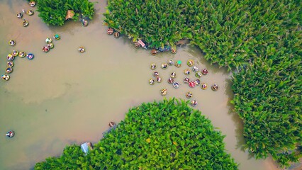 Aerial view, tourists are relax and experiencing a basket boat tour at the coconut water (mangrove...