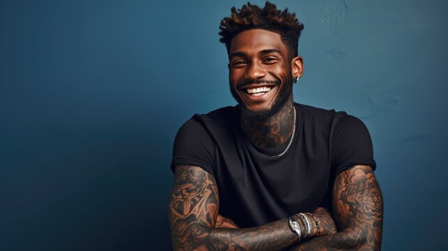 young black, African American man with tattoo smiles. portrait of a generation Z guy. drawing on the skin