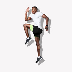 A strong and fit African-American man jumping. Muscular black male in a sports training pose....