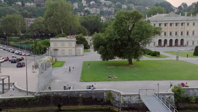 Aerial view of visitors walking near the Villa Olmo building in Como, Italy