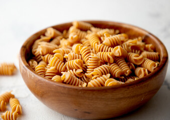 Organic Italian Chickpea Fusilli Pasta in a Wooden Bowl. Gluten-Free, Grain-Free, and Vegan Pasta....