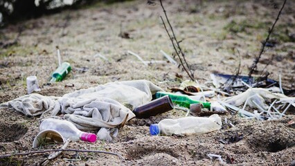 Closeup shot of garbage on the beach.