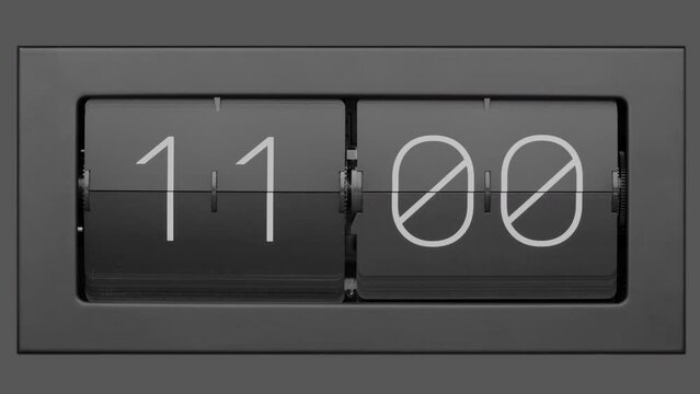 Retro flip clock changing from 10:59am to 11:00am.