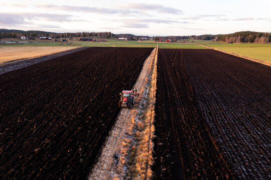 Aerial view of tractor plowing field