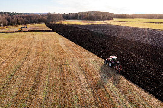 Aerial view of tractor plowing field