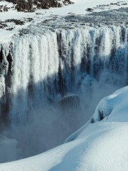 Scenic landscape shot of a majestic frozen waterfall in winter