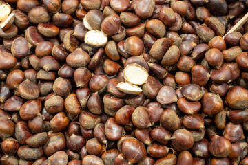 chestnuts cooked on the stove and eaten, fresh raw chestnuts from the forest, the fruit of the chestnut tree,
