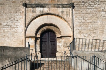 Medieval European church door with an arch.