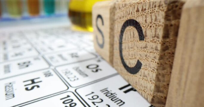 Wooden cubes neatly organized on desk creating word SCIENCE