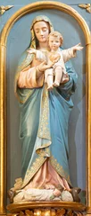 Foto auf Glas COURMAYEUR, ITALY - JULY 12, 2022:  The carved polychrome satatue of Madonna in the church Chiesa di San Pantaleone  © Renáta Sedmáková