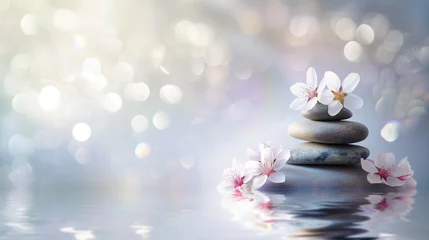 Foto op Plexiglas Zen stones with delicate flowers in a peaceful spa environment, reflecting in water. © md3d
