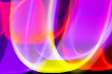 Neon Wavy Rainbow Swirls and Lines on Black Background