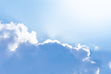 a serene sky adorned with fluffy white clouds on a beautiful blue canvas