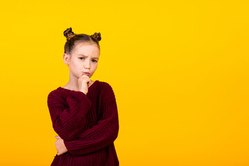 Photo of smart minded pensive girl hand touch chin ponder empty space isolated on yellow color background