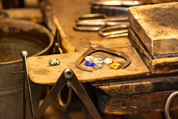 Glass master working in front of the furnace in Murano Island in Venice Italy