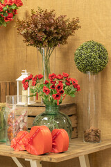 Rustic Autumn Decor with Red Flowers and Gifts
