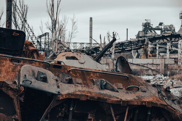 burnt tank and destroyed buildings of the Azovstal plant shop in Mariupol