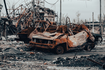 Fototapeta premium burnt cars and destroyed buildings of the workshop of the Azovstal plant in Mariupol