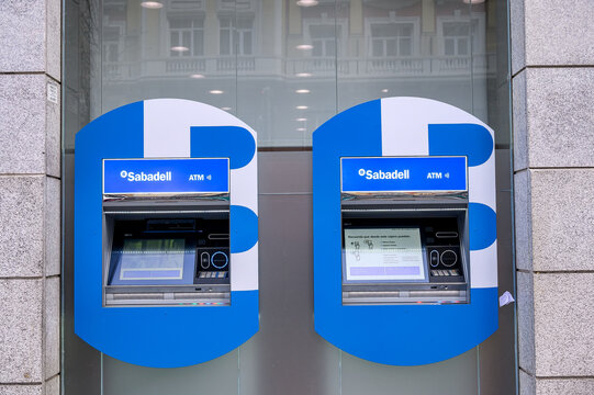 ATMs in the exterior of Sabadell Bank, Madrid, Spain
