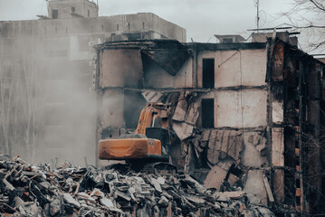 Fototapeta na wymiar demolition of destroyed and burnt houses in Ukraine during the war