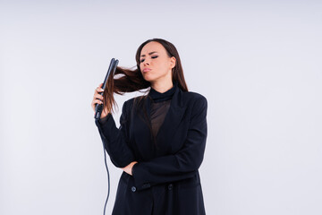 Brunette female holds hairdresser equipment. Beauty industry profession. Hairdresser.