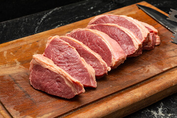 Steaks being prepared for barbecue party