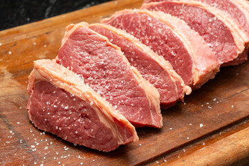 Steaks being prepared for barbecue party