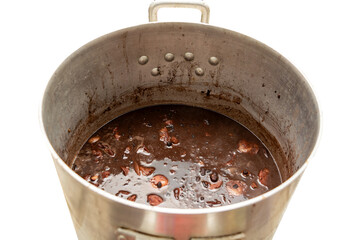 Brazilian feijoada traditional food with dark beans and pork