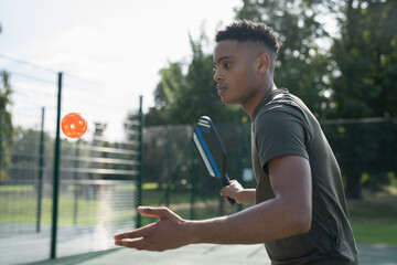Man playing pickleball © Cultura Creative