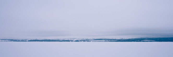 Lake Mjosa covered with ice, with a view towards Stange and Hedemarken.