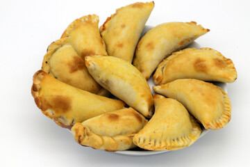 Plate of Empanadas on a white background.