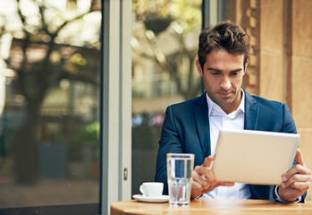 Businessman, tablet and coffee at cafe or reading for online research or communication, internet or...