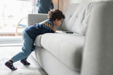 Boy (2-3) using digital tablet at home