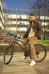 Obraz premium Portrait of young man on bicycle