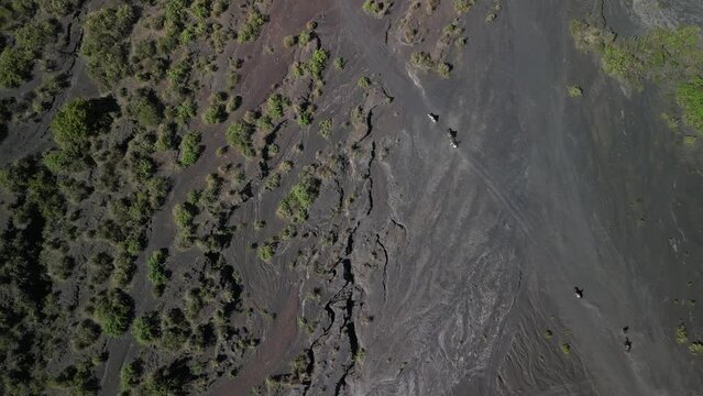 Aerial view of people riding horses on a trail in the volcanic fields near Paricutin volcano, Mexico