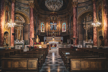 Fototapeta na wymiar A horizontal camera shot inside the beautiful Church - San Pietro (Borgio, Borgio Verezzi), Italy, Liguria, empty church