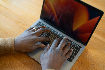Hands of senior man using laptop
