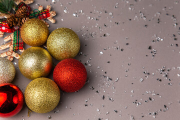 colorful Christmas decorations on grey background invitation card frame with copy space 