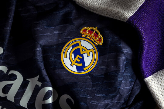 Madrid, Spain - February 9 2024 : Close up detail of Real Madrid football club icon attached to away soccer jersey with Adidas logo and fly emirates shirt sponsor. Horizontal landscape format
