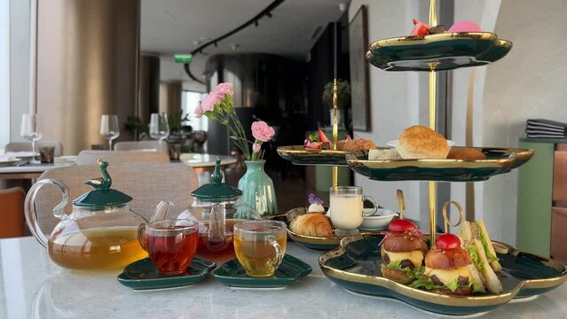 Gourmet food small miniature cakes burgers sandwiches breakfast with tea in Ho Chi Minh City overlooking city delicious food beautiful presentation expensive Luxury restaurant