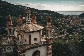 Tuinposter Church of the five bell towers in Liguria © Nikita